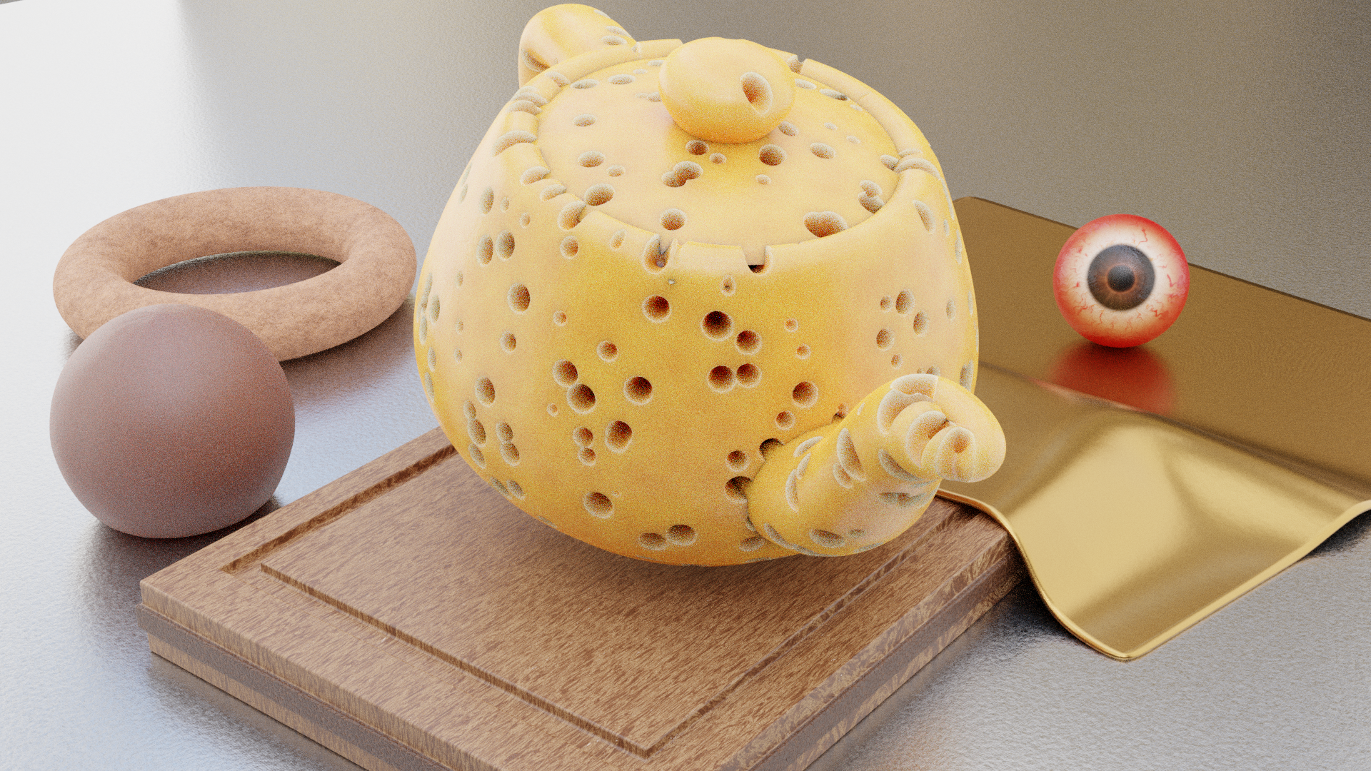 An assortment of objects with a teapot made out of cheese in the focus